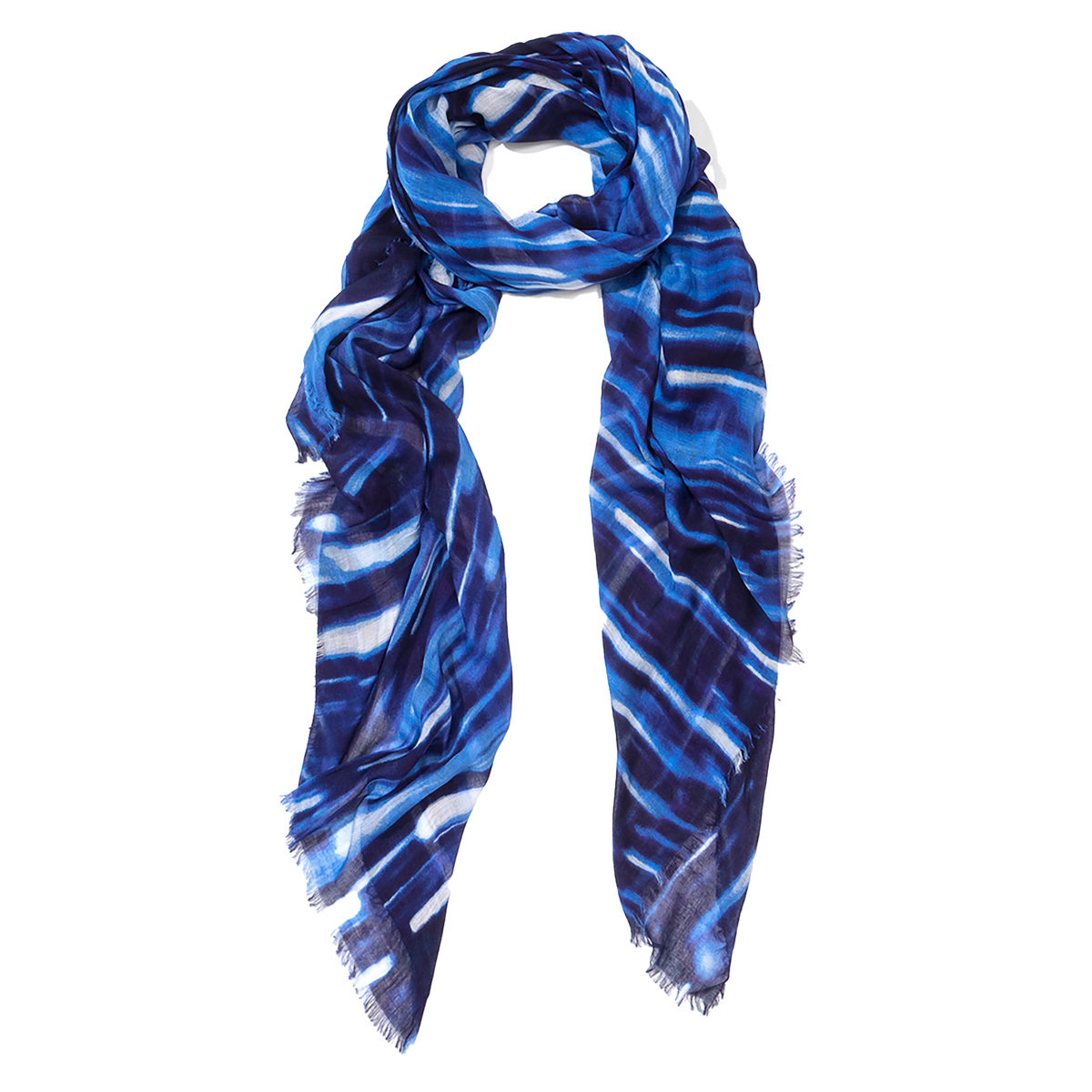 A lightweight scarf with a blue and white tie-dye pattern and fringed edges, displayed against a solid white background.